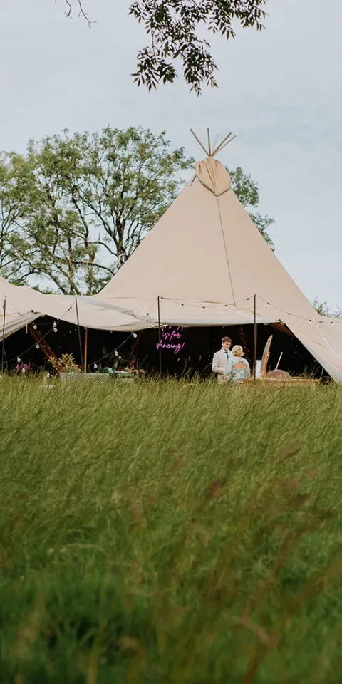 A teepee in a field