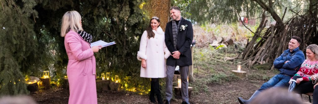 Sam White stood in a forest with Sinead and Michael