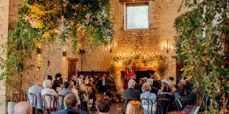 A photo of a wedding ceremony with Sam White Celebrant at Cripps Barn.