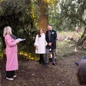 Sam White stood in a forest with Sinead and Michael