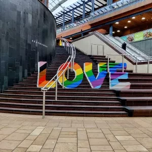 The word love painted on a set of stairs